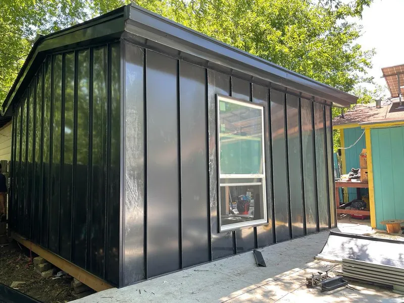 Black standing seam metal wall panels for Roof Inspection in River Edge